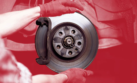 Examine front brake calipers, linings, discs and shoes